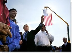 President George W. Bush greets employees of Rain for Rent following a Conversation on the Economy in Bakersfield, Calif., Thursday, March 4, 2004.  White House photo by Eric Draper