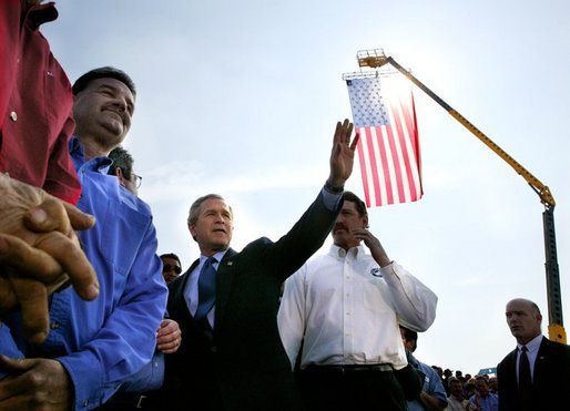 President George W. Bush greets employees of Rain for Rent following a Conversation on the Economy in Bakersfield, Calif., Thursday, March 4, 2004. White House photo by Eric Draper