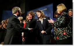 President George W. Bush greets participants at the Women's Entrepreneurship in the 21st Century Forum in Cleveland, Ohio, Wednesday, March 10, 2004.   White House photo by Paul Morse