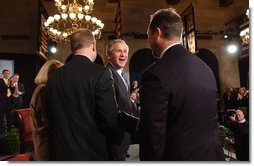 President George W. Bush greets participates in the President's conversation about health access at the U.S. Chamber of Commerce Tuesday, March 16, 2004.  White House photo by Tina Hager