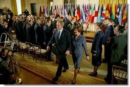 President George W. Bush and Laura Bush exit the East Room following the President's remarks commemorating the one-year anniversary of operation Iraqi Freedom and the efforts of his administration and 91 nations to ensure peace and stability in Iraq, Afghanistan and the Greater Middle East Friday, March 19, 2004.  White House photo by Susan Sterner