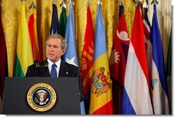 President George W. Bush speaks in the East Wing to mark the one-year anniversary of operation Iraqi Freedom and to highlight the efforts of his administration and 91 nations to ensure peace and stability in Iraq, Afghanistan and the Greater Middle East Friday, March 19, 2004.  White House photo by Susan Sterner