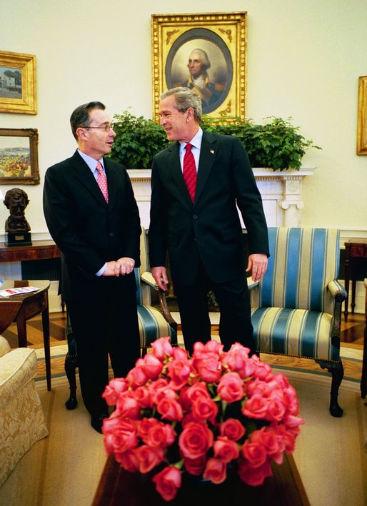 President George W. Bush meets with Colombian President Alvaro Uribe in the Oval Office Tuesday, March 23, 2004. White House photo by Eric Draper