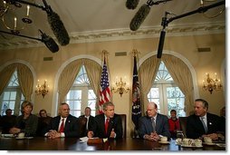 President George W. Bush talks with the press during a Cabinet Meeting at the White House Tuesday, March 23, 2004. Pictured sitting with the President are, from left: Interior Secretary Gale Norton, State Secretary Colin Powell, Treasury Secretary John Snow and Commerce Secretary Don Evans.  White House photo by Paul Morse