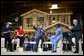 President George W. Bush acknowledges the audience at the conclusion of a conversation on homeownership at the Carpenters Training Center in Phoenix, Ariz., Friday, March 26, 2004. Pictured on stage with the President, from left, are construction foreman Jorge Sotelo, first-time homebuyer Emily McElhaney, first-time homebuyer Monica Sims and Doug McCarron, General President of the United Brotherhood of Carpenters and Joiners of America. White House photo by Eric Draper