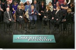 President George W. Bush leads a discussion on strengthening the economy and job training at Marshall Community & Technical College in Huntington, W.Va., Friday, April 2, 2004. Seated with President Bush are, from left: Huntington Career One Stop representative Rocky McCoy, MCTC CEO and Provost Dr. Vicki Riley, MCTC student Rina Angus, MCTC graduate Bryan Johnson, and small business owner Sally Oxley.  White House photo by Eric Draper