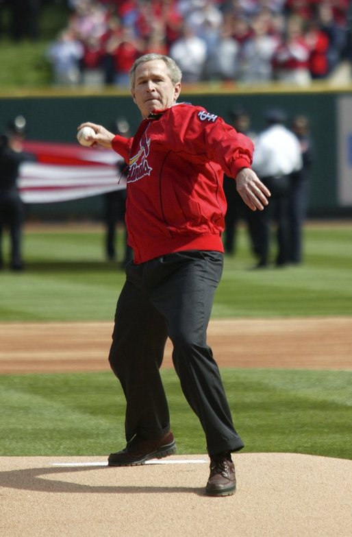 President George W. Bush throws out the first pitch during the St. Louis Cardinals’ season opener against the Milwaukee Brewers at Busch Stadium in St. Louis, Mo., Monday, April 5, 2004. White House photo by Eric Draper