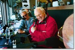 Vice President Dick Cheney talks with WLW-AM radio hosts after throwing out the first pitch on opening day in Cincinnati, Ohio at the Red's Great American Ballpark on April 5, 2004.  White House photo by David Bohrer