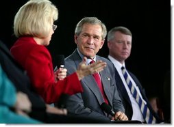 President George W. Bush listens to Dr. Kathy Matlock during a conversation on job training and the economy at South Arkansas Community College in El Dorado, Ark., Tuesday, April 6, 2004. Dr. Matlock is the President of South Arkansas Community College.  White House photo by Eric Draper