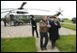 President George W. Bush escorts President Hosni Mubarak of Egypt after his arrival at the Bush Ranch in Crawford, Texas, Monday, April 12, 2004. White House photo by Eric Draper.