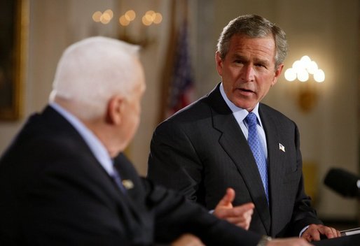 President George W. Bush and Israeli Prime Minister Ariel Sharon during a press conference in the Cross Hall of the White House on April 14, 2004. White House photo by Paul Morse.