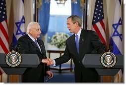 President George W. Bush and Israeli Prime Minister Ariel Sharon during a press conference in the Cross Hall of the White House on April 14, 2004.   White House photo by Paul Morse