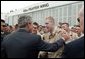 President George W. Bush talks with Robert Jackson of the 186th Military Police Company at the Iowa Air National Guard Base in Des Moines, Iowa, Thursday, April 15, 2004. Jackson was injured while serving in Iraq. White House photo by Paul Morse