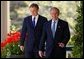 President George W. Bush and Prime Minister Tony Blair walk along the colonnade before a press conference in the Rose Garden of the White House on April 16, 2004. White House photo by Paul Morse.