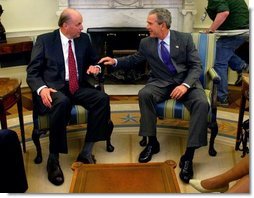 Announcing his intention to nominate him to be the U.S. Ambassador to Iraq, President George W. Bush talks with John Negroponte, who currently serves as the U.S. Ambassador to the United Nations, in the Oval Office Monday, April 19, 2004  White House photo by Eric Draper