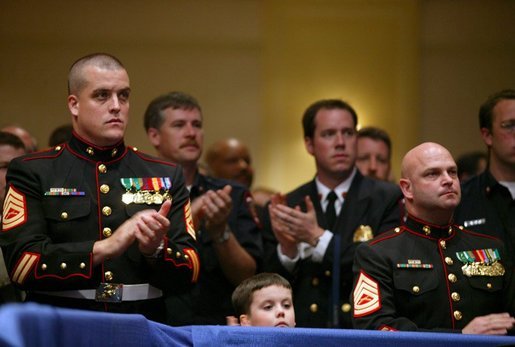 Local military and emergency first responders listen to President George W. Bush talk about the USA Patriot Act in Hershey, Pa., Monday, April 19, 2004. White House photo by Paul Morse.