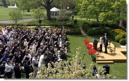 President George W. Bush and First Lady Mrs. Laura Bush with Kathleen Mellor the 2004 Teacher of the Year from South Kingstown, Rhode Island in the Rose Garden of the White House on April 21, 2004.  White House photo by Paul Morse