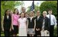 President George W. Bush congratulates the West Branch Middle School Science Club of West Branch, Iowa, on receiving the President’s Environmental Youth Award in the East Garden April 22, 2004. White House photo by Susan Sterner.