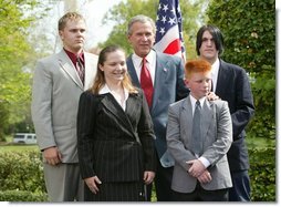 President George W. Bush congratulates the Busy Bison 4-H Club of Barrackville, W.Va., on receiving the President’s Environmental Youth Award in the East Garden April 22, 2004. Members of this club include, from left to right, James Taylor, 15, Katie Ridenour, 16, Cody Gallagher, 9, and Derek Swiger.  White House photo by Susan Sterner