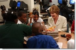 Laura Bush attends a class with middle school students during Mrs. Hatty Drew’s reading lab at the Snowden School in Memphis, Tenn. Friday, April 23, 2004.  White House photo by Tina Hager