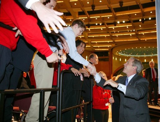 President George W. Bush greets the crowd after giving remarks to the American Associations of Community Colleges annual convention in Minneapolis, Minn., Monday, April 26, 2004. White House photo by Paul Morse.