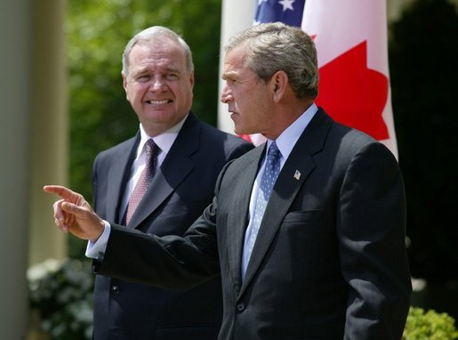 President George W. Bush and Canadian Prime Minister Paul Martin respond to questions from the press corps in the Rose Garden after a meeting at the White House on April 30, 2004. White House photo by Paul Morse