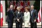 President George W. Bush and Mrs. Laura Bush with Canadian Prime Minister Paul Martin and his wife Sheila Martin after responding to questions from the press corps in the Rose Garden of the White House on April 30, 2004. White House photo by Paul Morse