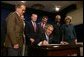 President George W. Bush signs into effect the Indian Education Executive Order in Room 450 of the Old Executive Building on April 30, 2004. White House photo by Paul Morse