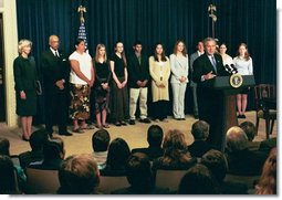 President George W. Bush delivers remarks about the Indian Education Executive Order at the Eisenhower Executive Office Building Friday, April 30, 2004. With the President are Secretary of the Interior Gale Norton and Secretary of Education Rod Paige and students from the Sault Ste Marie, Michigan, High School and Chiloquin, Oregon, High School Native American Science Bowl Teams.  White House photo by Tina Hager