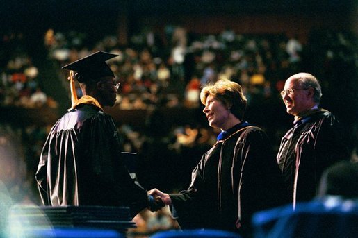 Laura Bush congratulates a graduate from the Class of 2004 of Miami Dade College in Miami, Fla., Saturday, May 1, 2004. White House photo by Tina Hager