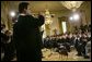 President George W. Bush listens to Banda El Recodo during a White House ceremony honoring Cinco de Mayo in the East room Wednesday, May 5, 2004. Mexican recording artists Marco Antonio Solis and Jimena also performed during the event. White House photo by Paul Morse