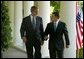 President George W. Bush and His Majesty King Abdullah Bin Al Hussein of Jordan walk together after holding a joint press conference in the Rose Garden Thursday, May 6, 2004. White House photo by Paul Morse