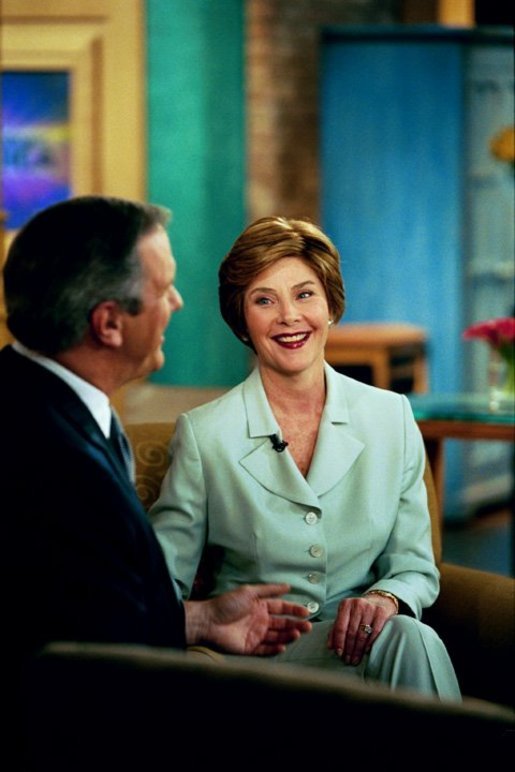 Laura Bush speaks with Charlie Gibson during a Good Morning America live interview at the ABC Studios in New York City, Monday, May 10, 2004. White House photo by Tina Hager