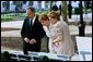 Laura Bush views drawings for the "Gardens of Remembrance," a September 11th memorial, with Mrs. Warrie Price, Founder and President of The Battery Conservancy, and New York City Mayor Michael Bloomberg in New York's Battery Park Monday, May 10, 2004. White House photo by Tina Hager