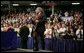 President George W. Bush walks on stage to deliver remarks on the No Child Left Behind Act at Butterfield Junior High School in Van Buren, Ark., Tuesday, May 11, 2004. "Under the new law, when children are falling behind, the schools that need the most attention get extra help, extra money, so the children can catch up," said the President in his remarks. White House photo by Paul Morse