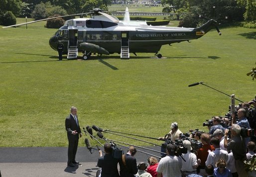 President George W. Bush makes a statement to the press about the killing of U.S. civilian Nicholas Berg on the South Lawn Wednesday, May 12, 2004. "I want to express my condolences to the family and friends of Nicholas Berg. Nicholas Berg was an innocent civilian who was in Iraq to help build a free Iraq. There is no justification for the brutal execution of Nicholas Berg -- no justification whatsoever," said the President. White House photo by Eric Draper