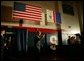 President George W. Bush salutes law enforcement officers before participating in a conversation on High School Initiatives at Parkersburg South High School in Parkersburg, W. Va., Thursday, May 13, 2004. White House photo by Paul Morse