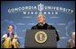 President George W. Bush is greeted with cheers as he begins his address at the commencement ceremonies for Concordia University near Milwaukee, Wis., Friday, May 14, 2004. White House photo by Paul Morse.