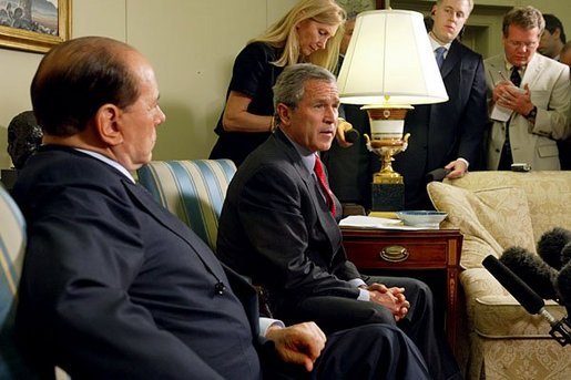 President George W. Bush and Prime Minister Silvio Berlusconi of Italy address the media in the Oval Office Wednesday, May 19, 2004. White House photo by Joyce Naltchayan.