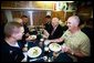 After delivering the commencement address at the U.S. Coast Guard Academy, Vice President Dick Cheney has lunch with sailors aboard the attack submarine USS Virginia Wednesday, May 19, 2004. The Vice President visited the Groton, Conn., boat yard to thank enlisted sailors and officers for their service, and to receive a briefing on the ship’s capabilities. White House photo by David Bohrer.