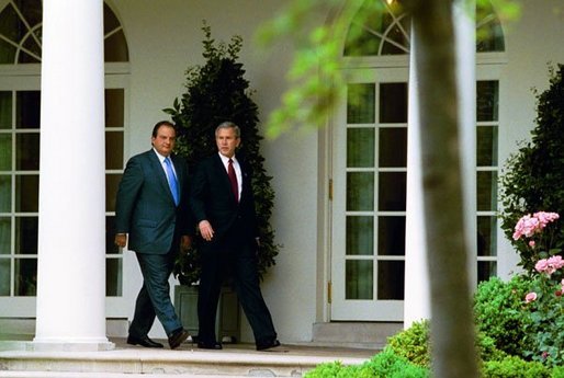 After meeting in the Oval Office, President George W. Bush and Prime Minister Konstandinos Karamanlis of Greece visit the Rose Garden Thursday, May 20, 2004. White House photo by Joyce Naltchayan