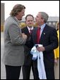 President George W. Bush greets Jason Matthews of the Tennessee Titans NFL team after arriving in Nashville, Tenn., May 27, 2004. White House photo by Paul Morse