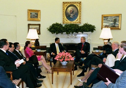 President George W. Bush meets with President Francisco Flores Perez of El Salvador in the Oval Office Thursday, May 27, 2004. White House photo by Joyce Naltchayan