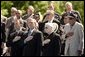 President George W. Bush sings the National Anthem with World War II veterans during the dedication of at the National World War II memorial on the Mall in Washington, DC on May 30, 2004. White House photo by Paul Morse