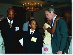 President George W. Bush talks with guests at the 1st White House National Conference on Faith-Based and Community Initiatives in Washington, D.C., Tuesday, June 1, 2004.  White House photo by Joyce Naltchayan