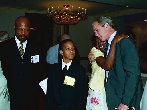 President George W. Bush talks with guests at the 1st White House National Conference on Faith-Based and Community Initiatives in Washington, D.C., Tuesday, June 1, 2004. White House photo by Joyce Naltchayan.