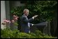 President George W. Bush welcomes the new members of Iraq's interim government during a statement in the Rose Garden Tuesday, June 1, 2004. The U.S.-led Coalition Provisional Authority will transfer sovereignty to Iraq's Interim President Sheikh Ghazi al-Yawar and Interim Prime Minister Iyad Allawi on June 30. White House photo by Eric Draper.