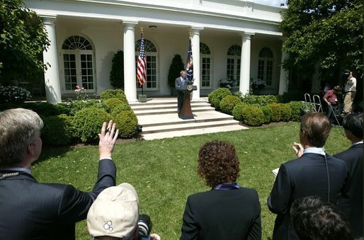 After welcoming the new members of Iraq's interim government, President George W. Bush answers questions from the press in the Rose Garden Tuesday, June 1, 2004. White House photo by Eric Draper.