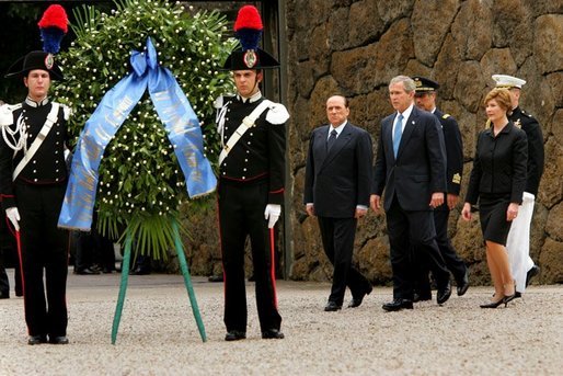 President George W. Bush with Mrs. Bush and Prime Minister of Italy Silvio Berlusconi participate in a wreath laying ceremony at Fosse Ardeatine in Rome, Italy, Friday, June 4, 2004. White House photo by Paul Morse