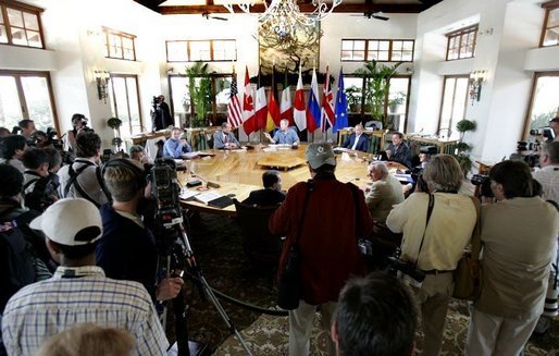 President George W. Bush participates in a plenary meeting with leaders during the G8 Summit on Sea Island, Ga., Wednesday, June 9, 2004. Clockwise, Russian President Vladimir Putin, German Chancellor Gerhard Schroeder, Italian Prime Minister Silvio Berlusconi, European Council President Bertie Ahern, European Commission President Romano Prodi, Canadian Prime Minister Paul Maritn, Japanese Prime Minister Junichiro Koizumi, British Prime Minister Tony Blair and French President Jacques Chirac. White House photo by Eric Draper